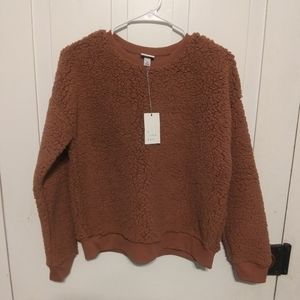 a · new day Fuzzy Sweatshirt